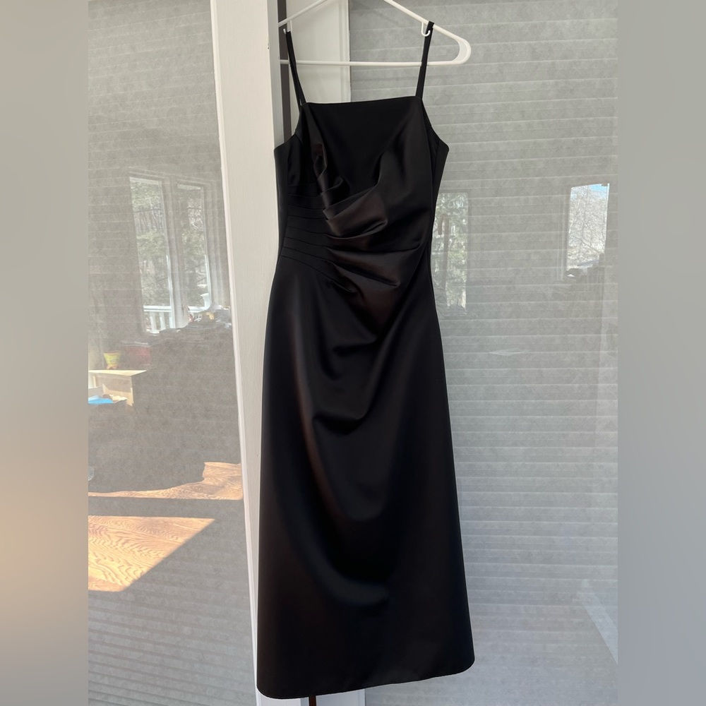 Black evening gown with rouching at the top. Size 10, 51 inch length 27 waist